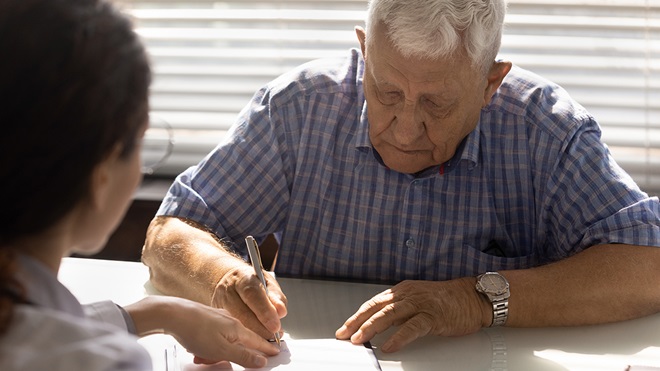 senior_person_signing_a_form